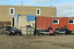 Houses and snow machines in Tuk
